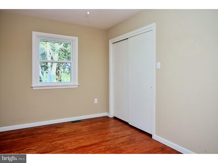 123 Sharp Road Avondale, PA 19311 - Photo 19 of 24 a view of an empty room with wooden floor and a window