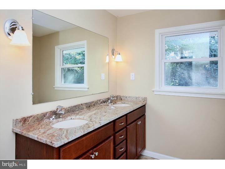 123 Sharp Road Avondale, PA 19311 - Photo 20 of 24 a bathroom with a granite countertop sink and a mirror