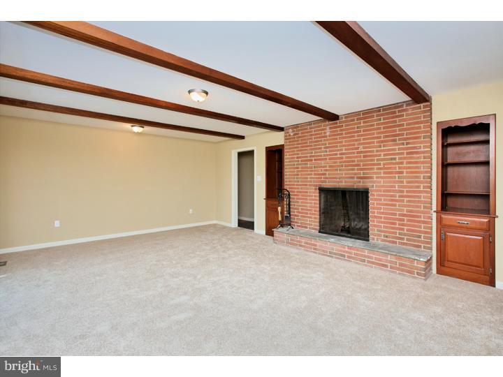 123 Sharp Road Avondale, PA 19311 - Photo 8 of 24 a view of an empty room with a fireplace and a window