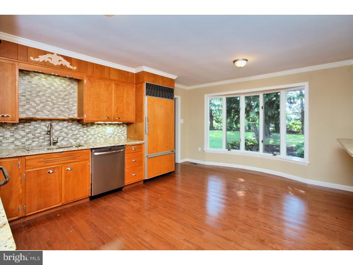 123 Sharp Road Avondale, PA 19311 - Photo 10 of 24 a kitchen with granite countertop wooden floors and wide window