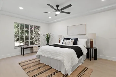 a bedroom with a bed and a table