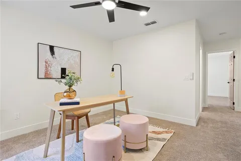 a bathroom with a toilet a sink and a mirror