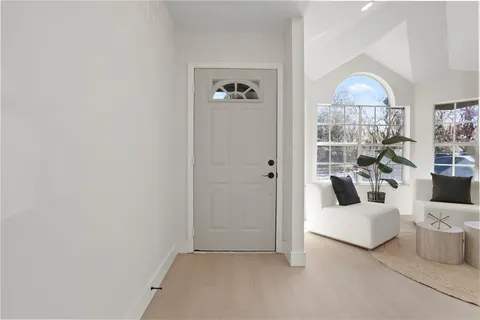 a view of a livingroom with furniture and window