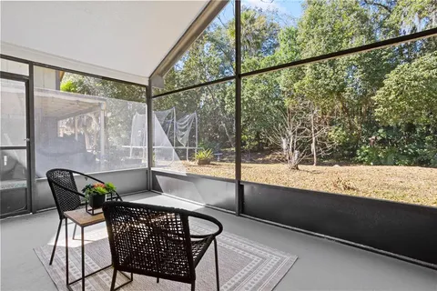 a view of a room with furniture and windows