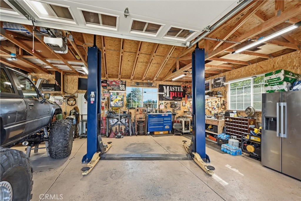20257 Indian Rock Road Hidden Valley Lake, CA 95467 - Photo 22 of 33 Large garage has car lift, which may be included in sale.