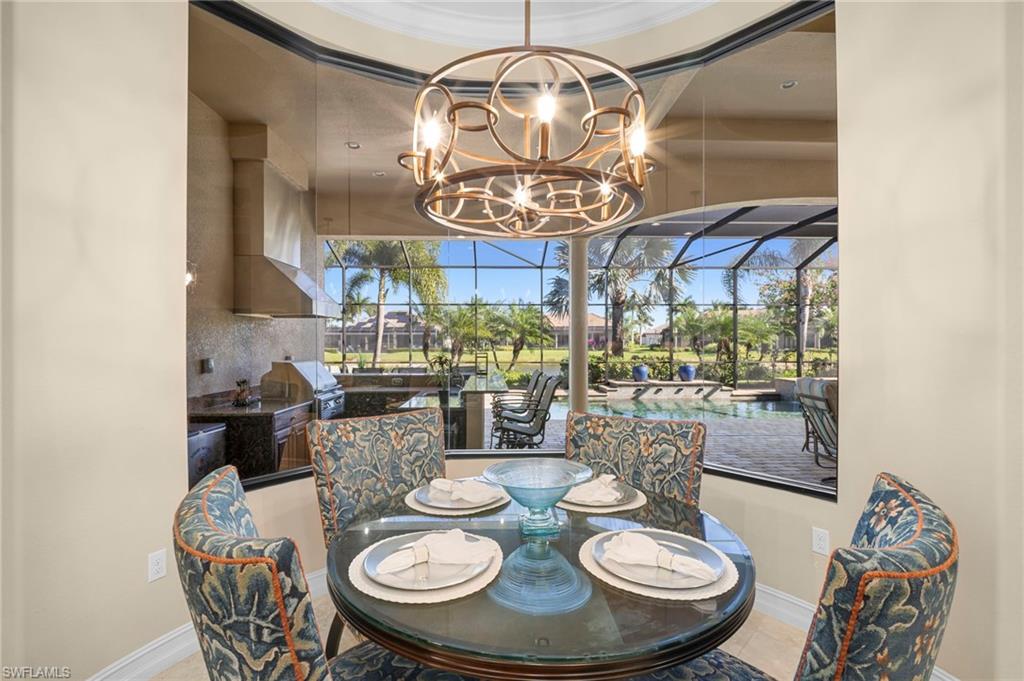 6482 Carema Lane Naples, FL 34113 - Photo 12 of 40 a view of a dining room with furniture