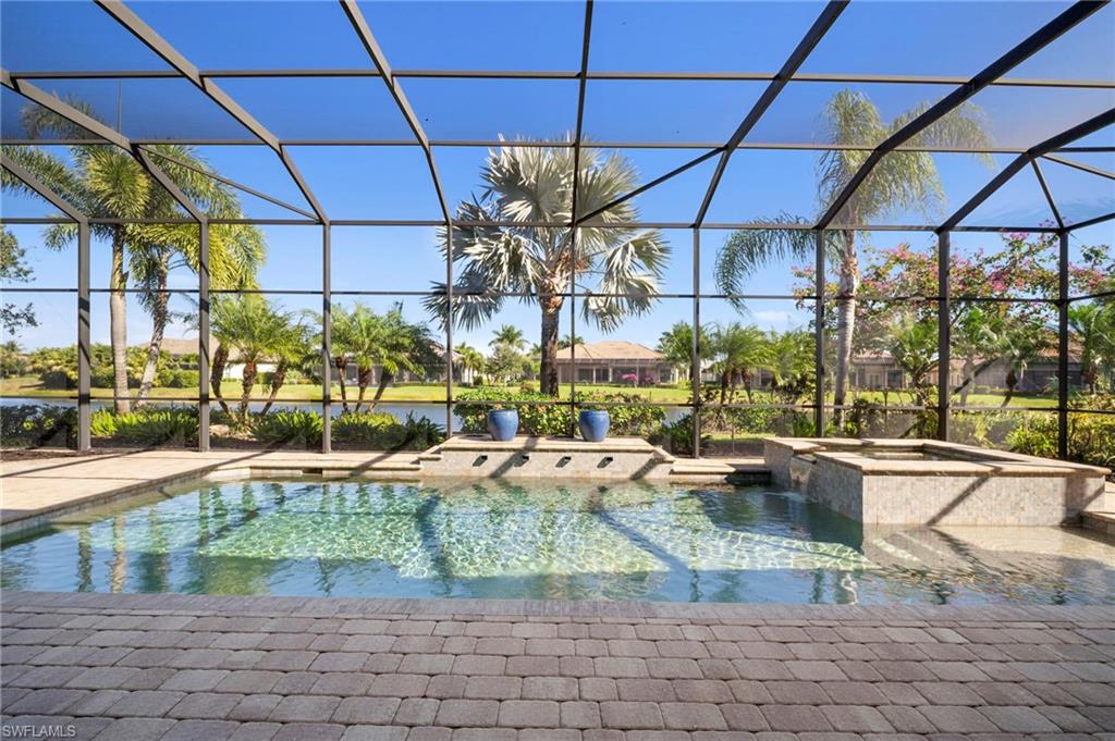 6482 Carema Lane Naples, FL 34113 - Photo 31 of 40 a view of a swimming pool with a patio