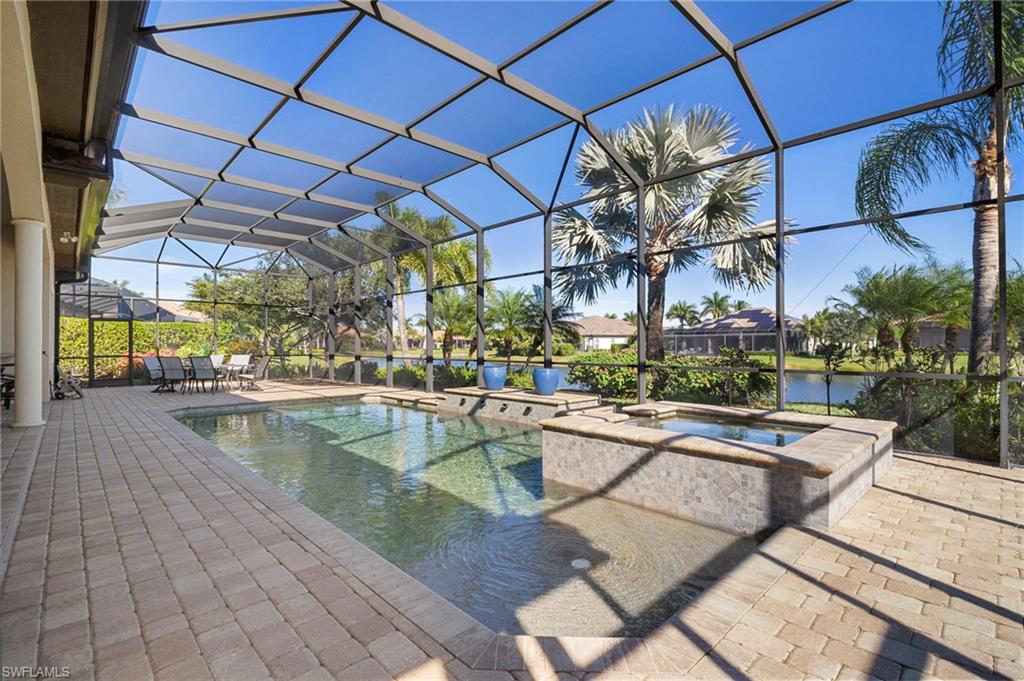 6482 Carema Lane Naples, FL 34113 - Photo 34 of 40 a view of a swimming pool with a patio