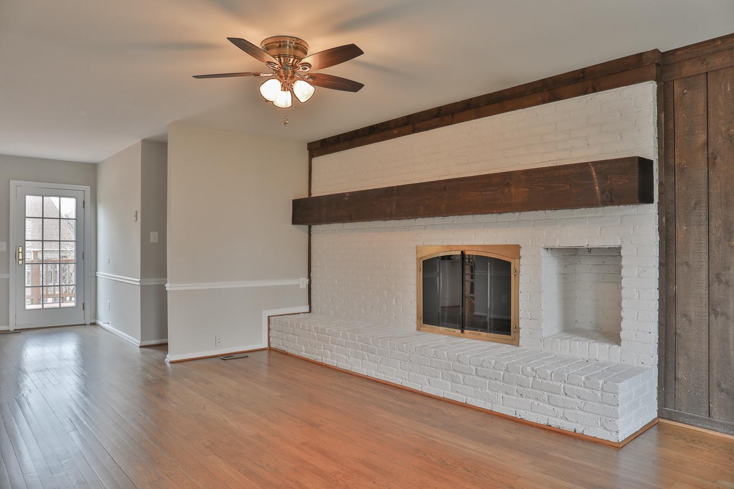 5423 Rilian Court Burke, VA 22015 - Photo 34 of 67 a view of an empty room with a window and wooden floor