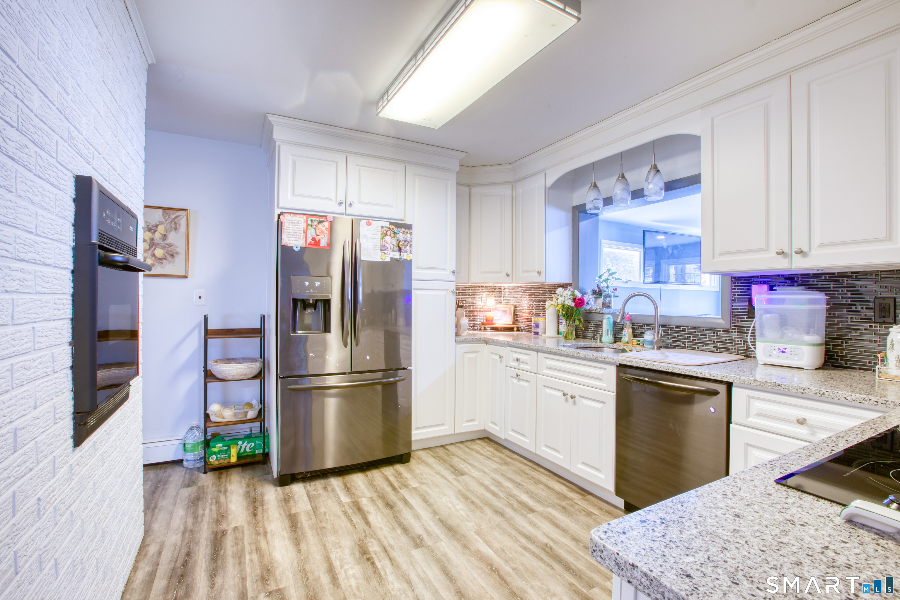 4 Edmond Road Bethel, CT 06801 - Photo 12 of 40 a kitchen with granite countertop a refrigerator stove top oven and sink