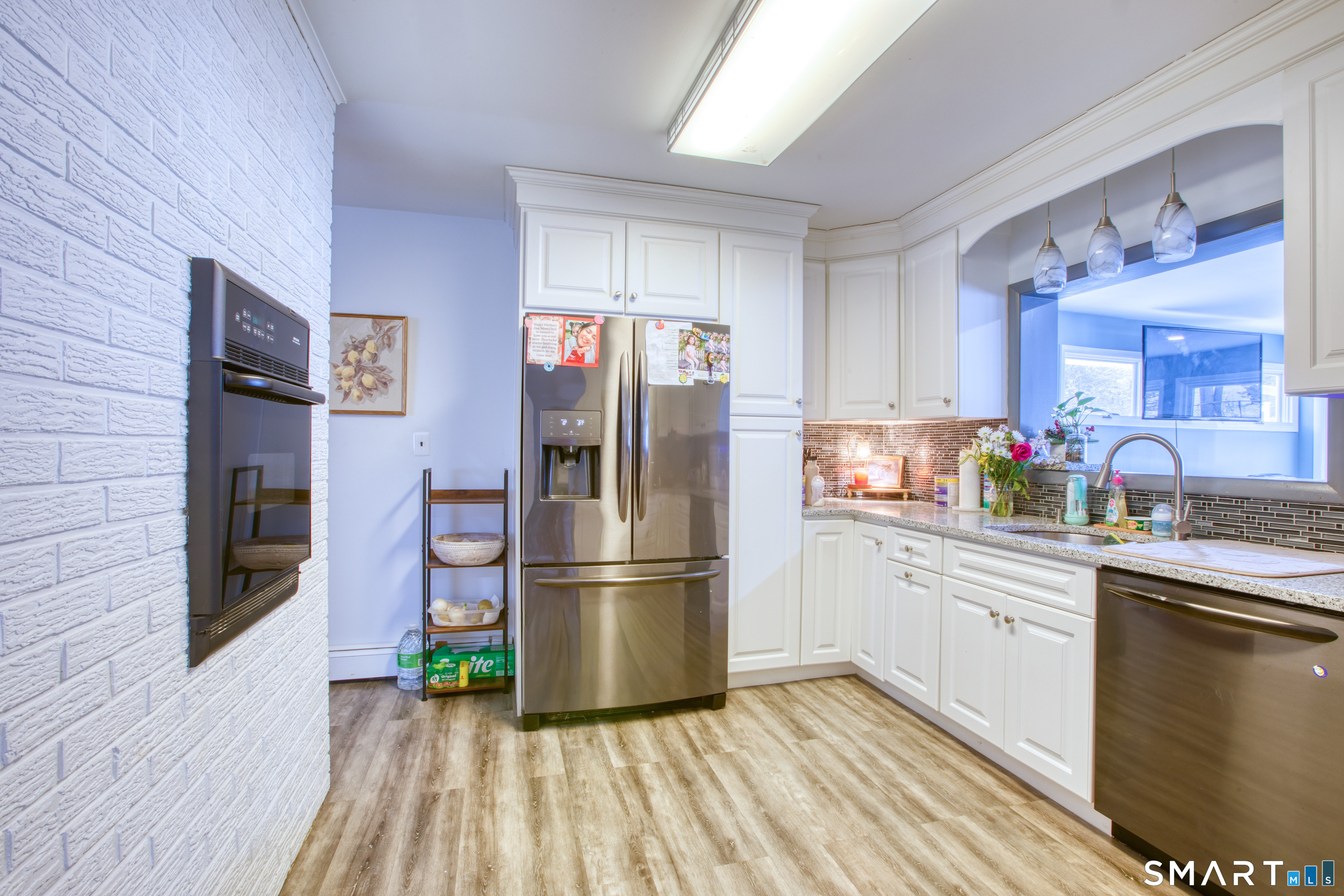 4 Edmond Road Bethel, CT 06801 - Photo 13 of 40 a kitchen with a refrigerator wooden floor and a sink