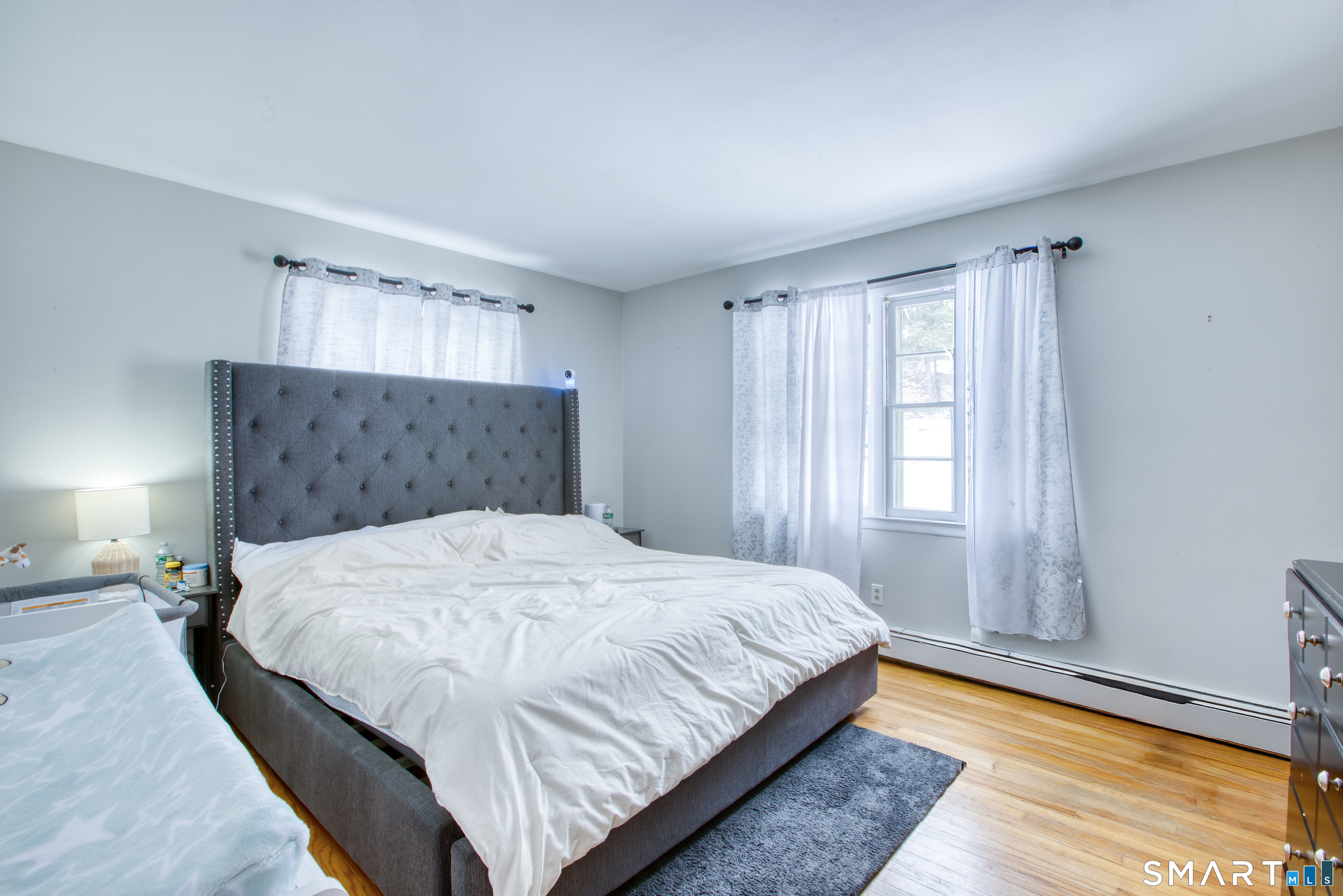 4 Edmond Road Bethel, CT 06801 - Photo 15 of 40 a large bed sitting in a bedroom next to a window