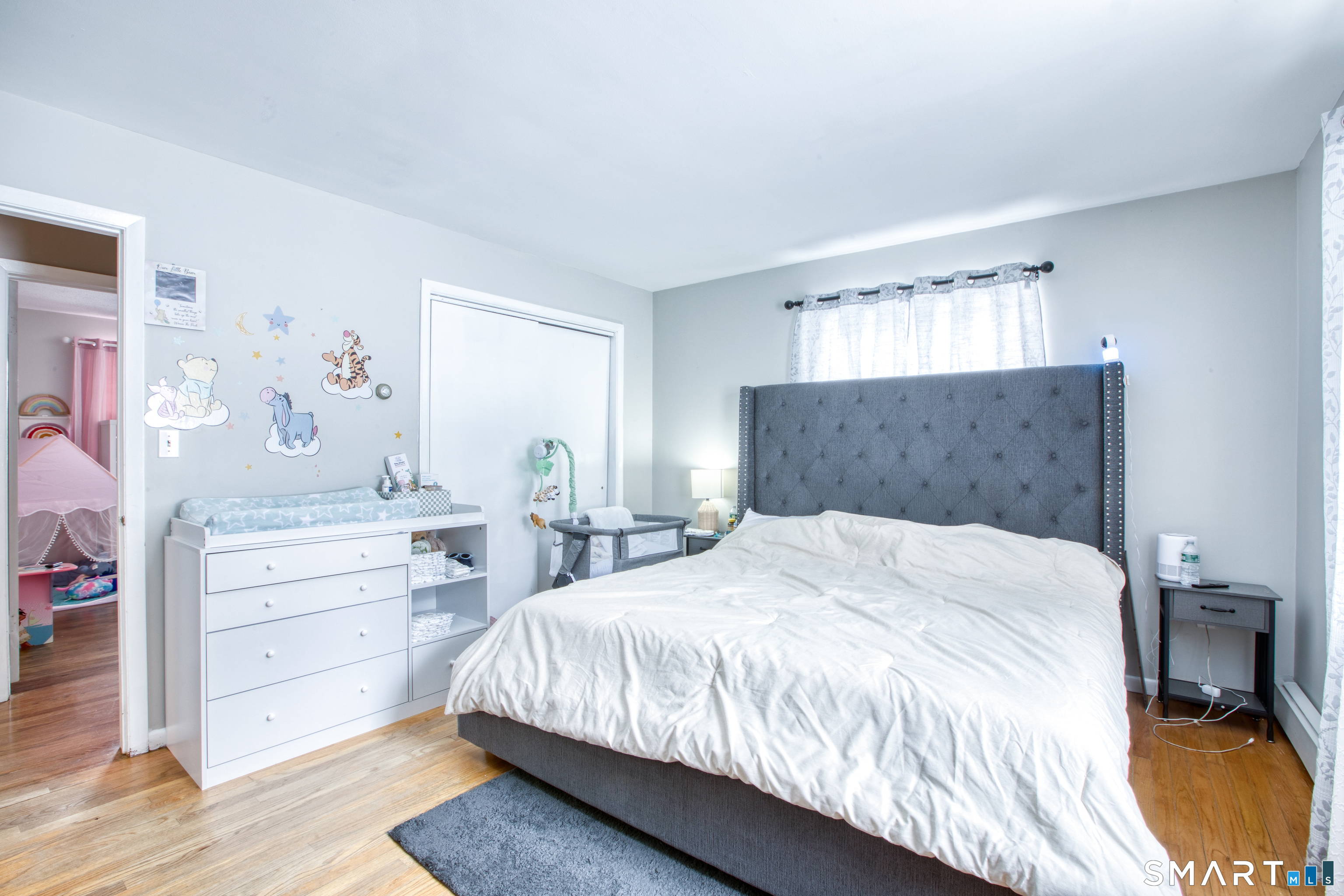 4 Edmond Road Bethel, CT 06801 - Photo 18 of 40 a bedroom with a bed and a dresser