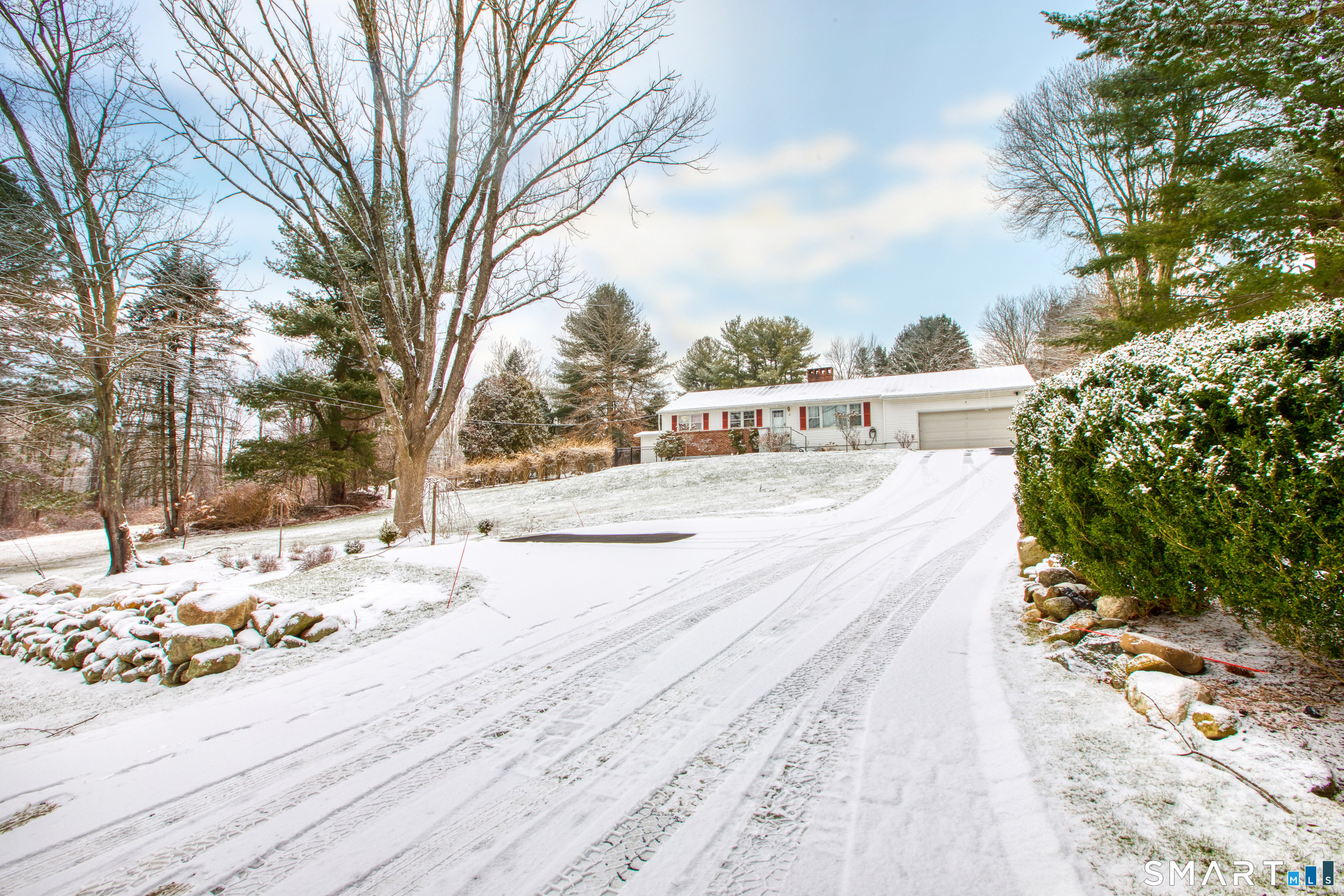 4 Edmond Road Bethel, CT 06801 - Photo 2 of 40 a view of a park with snow on the road