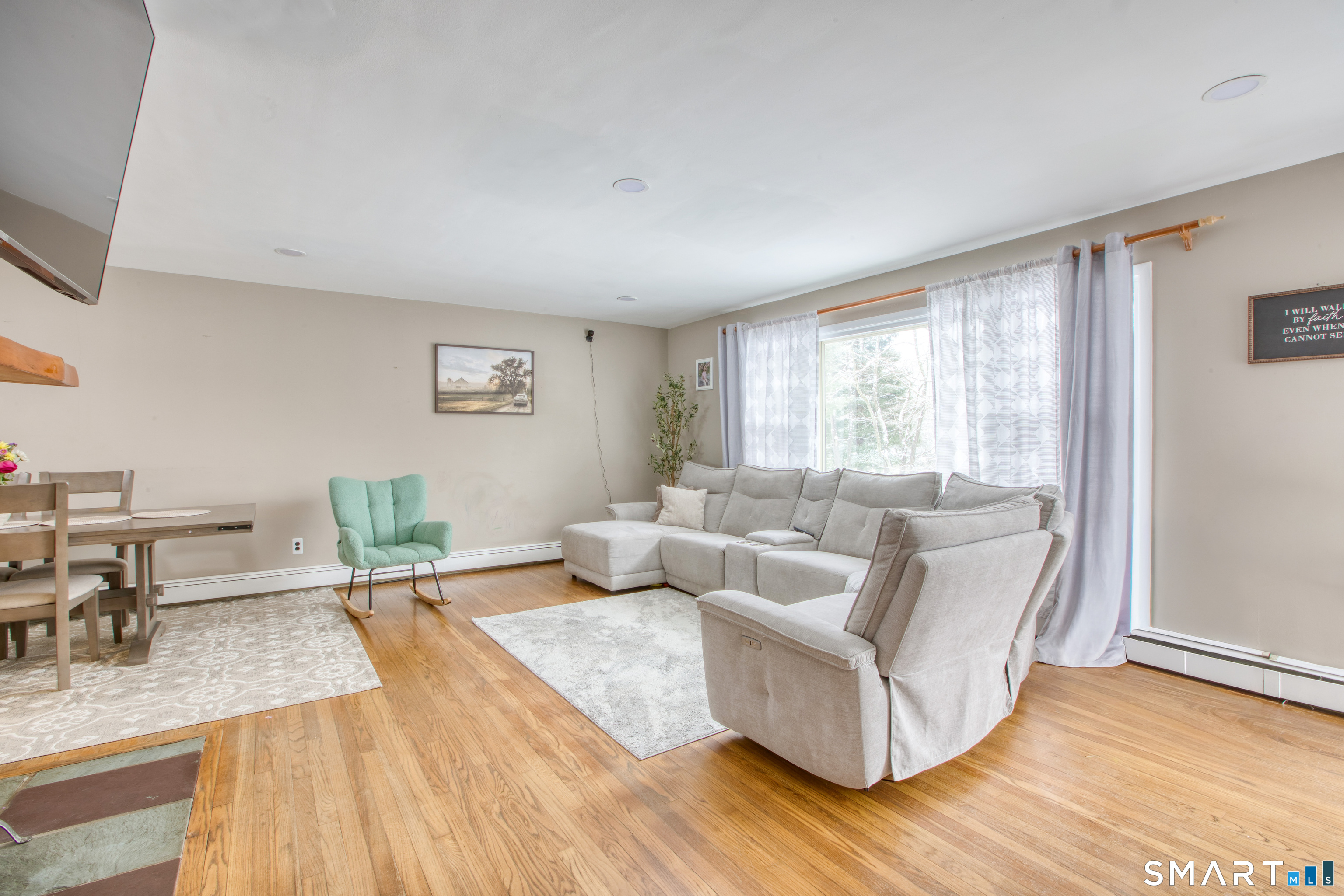 4 Edmond Road Bethel, CT 06801 - Photo 22 of 40 a living room with furniture and a wooden floor