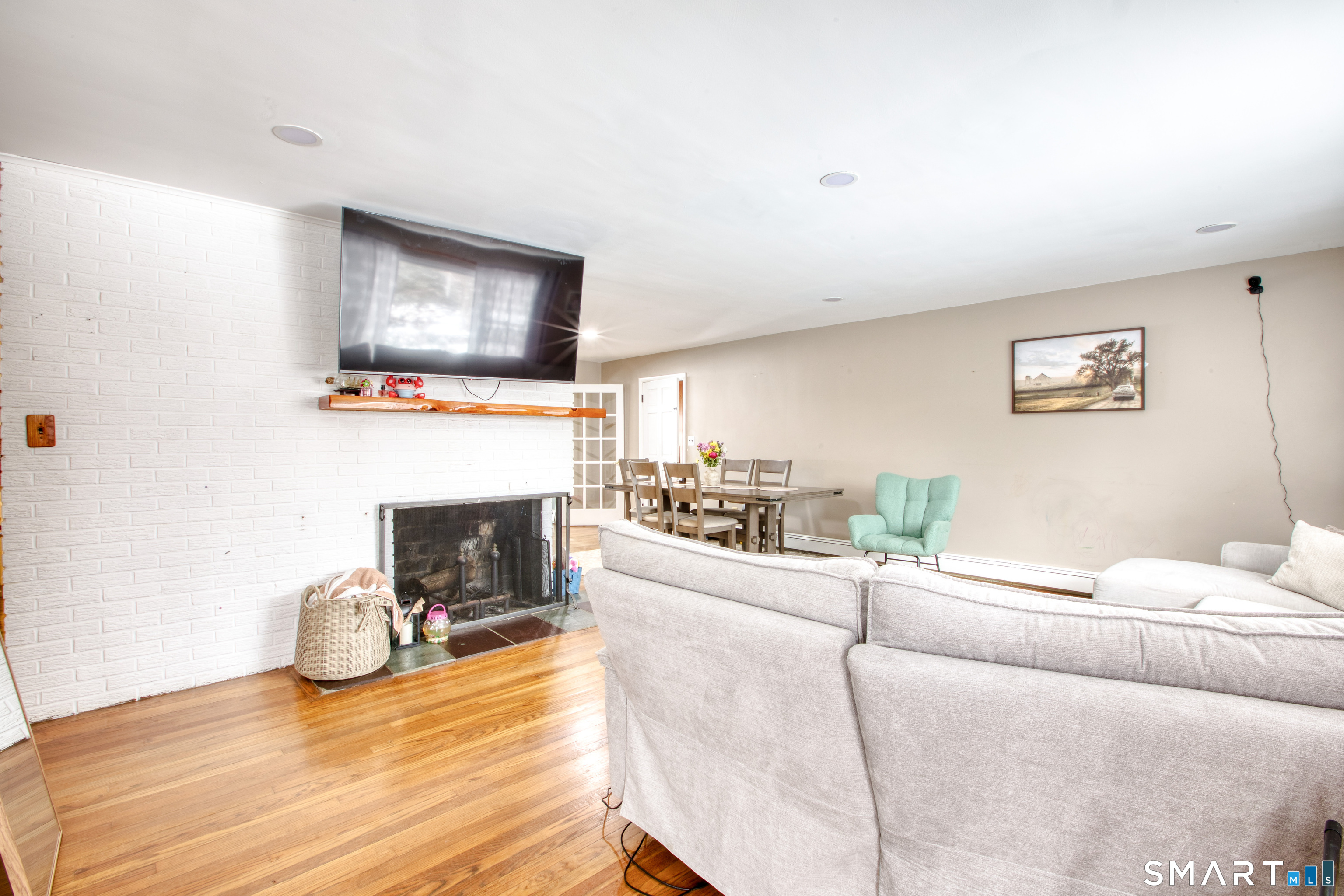 4 Edmond Road Bethel, CT 06801 - Photo 23 of 40 a living room with furniture and a flat screen tv