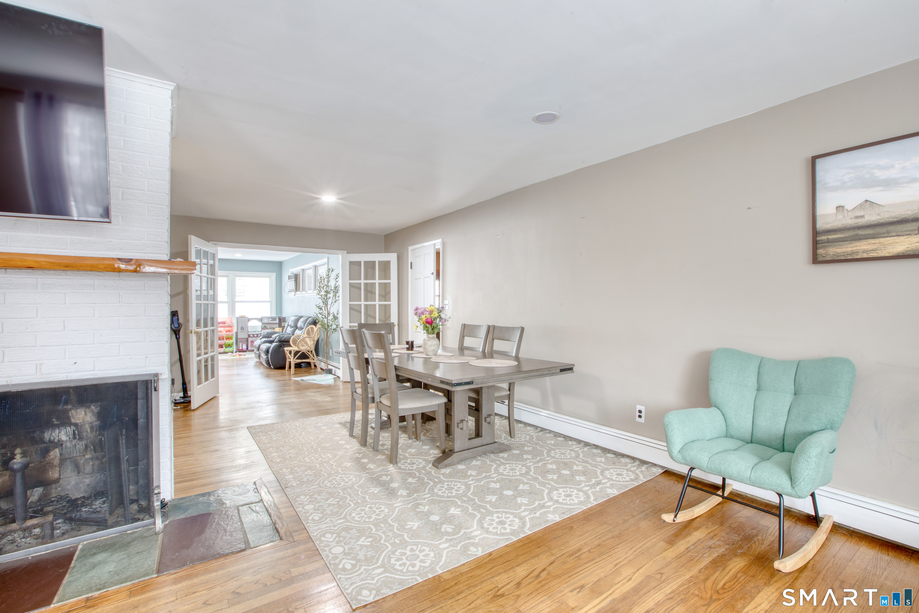 4 Edmond Road Bethel, CT 06801 - Photo 26 of 40 a living room with furniture and a fireplace
