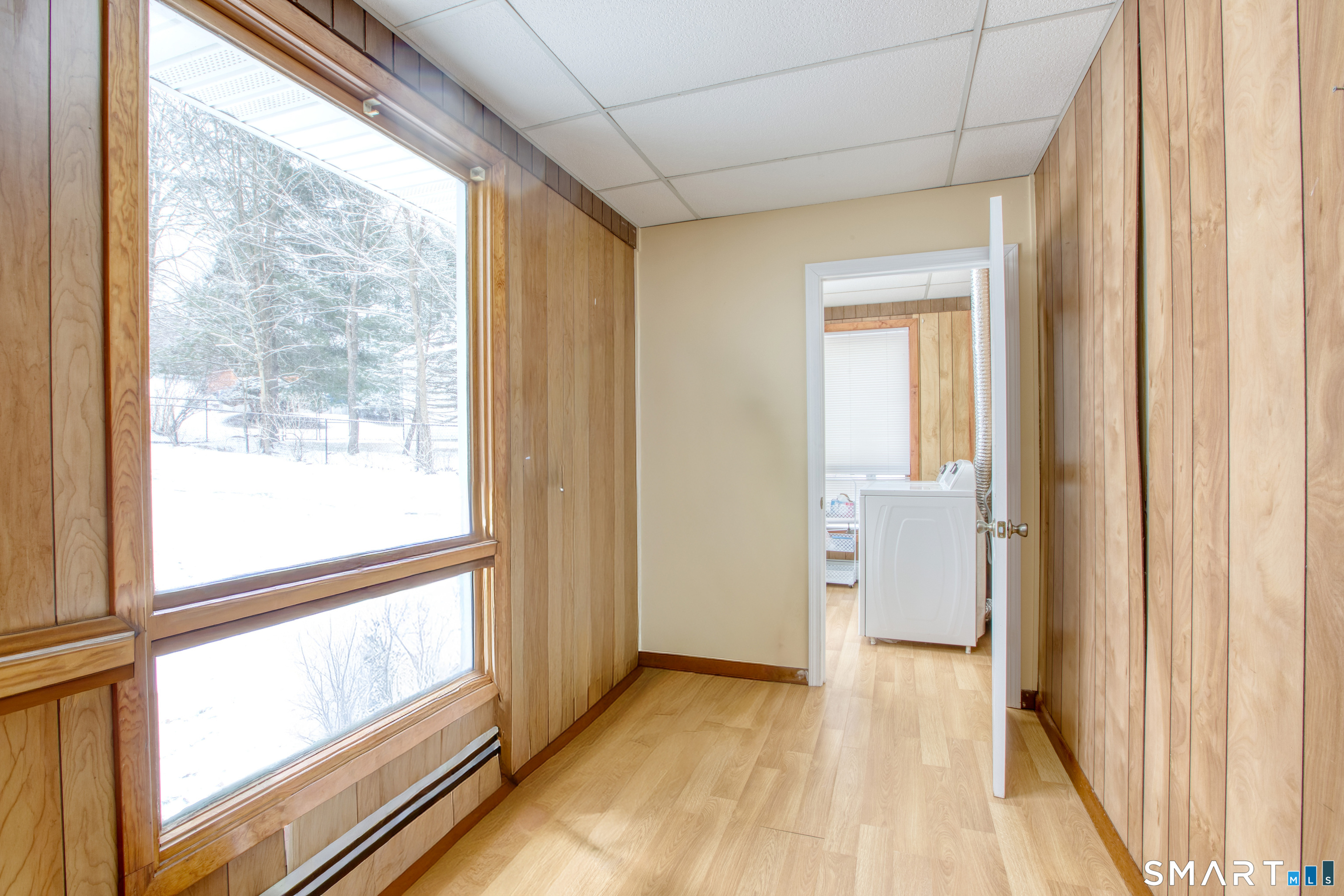 4 Edmond Road Bethel, CT 06801 - Photo 28 of 40 a view of hallway with a large window and wooden floor