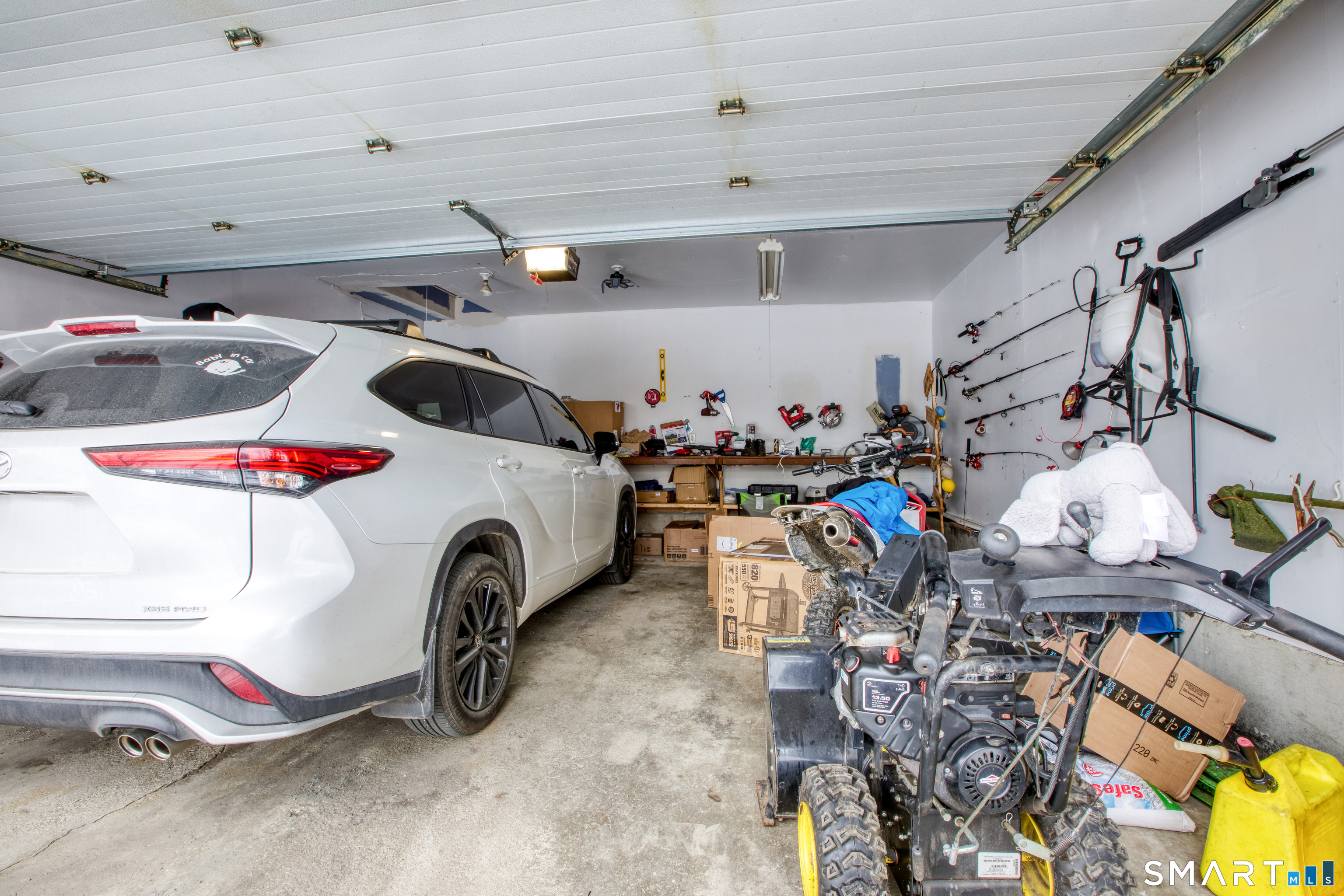 4 Edmond Road Bethel, CT 06801 - Photo 30 of 40 a utility room with dryer and bicycles