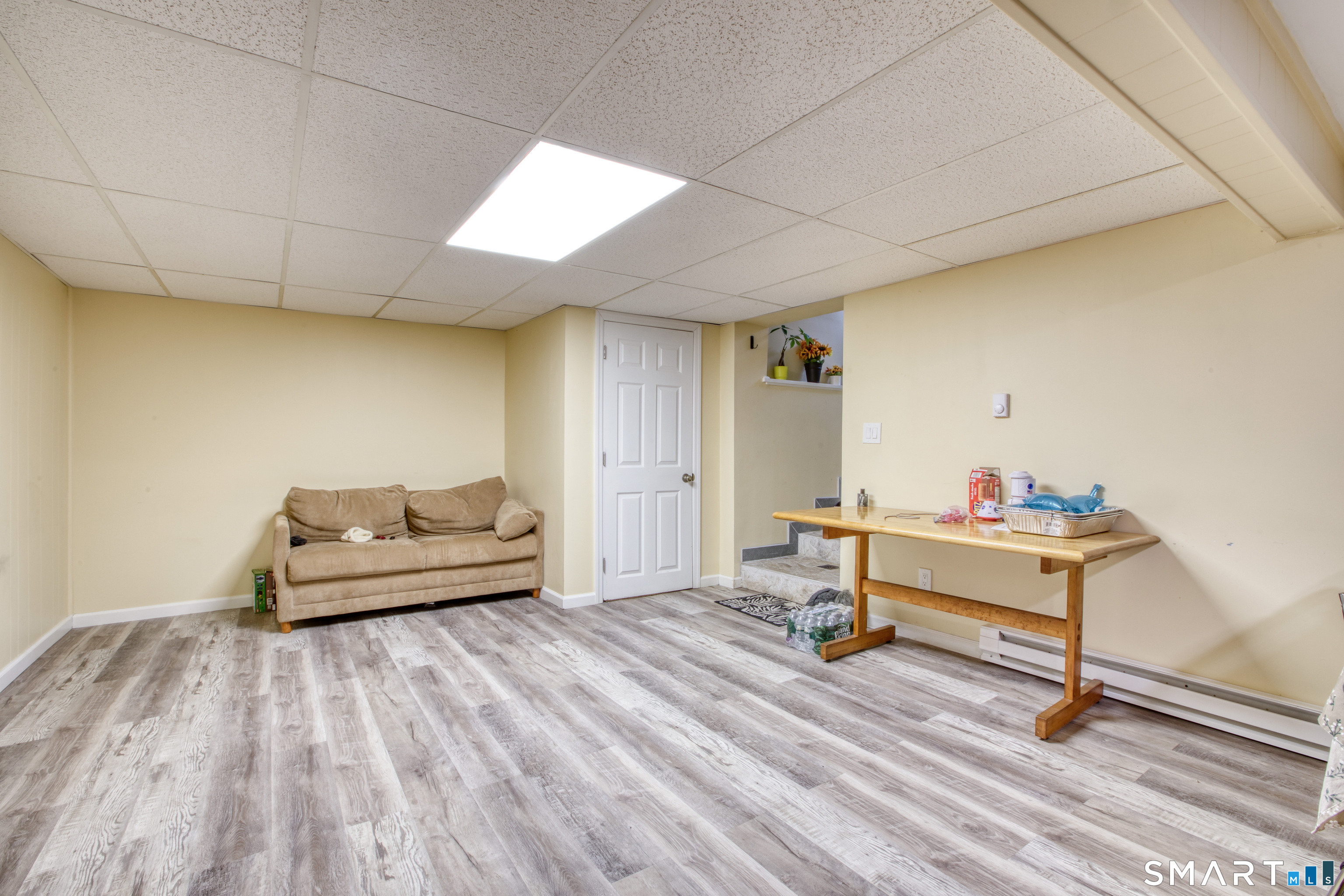 4 Edmond Road Bethel, CT 06801 - Photo 33 of 40 a living room with furniture and a wooden floor
