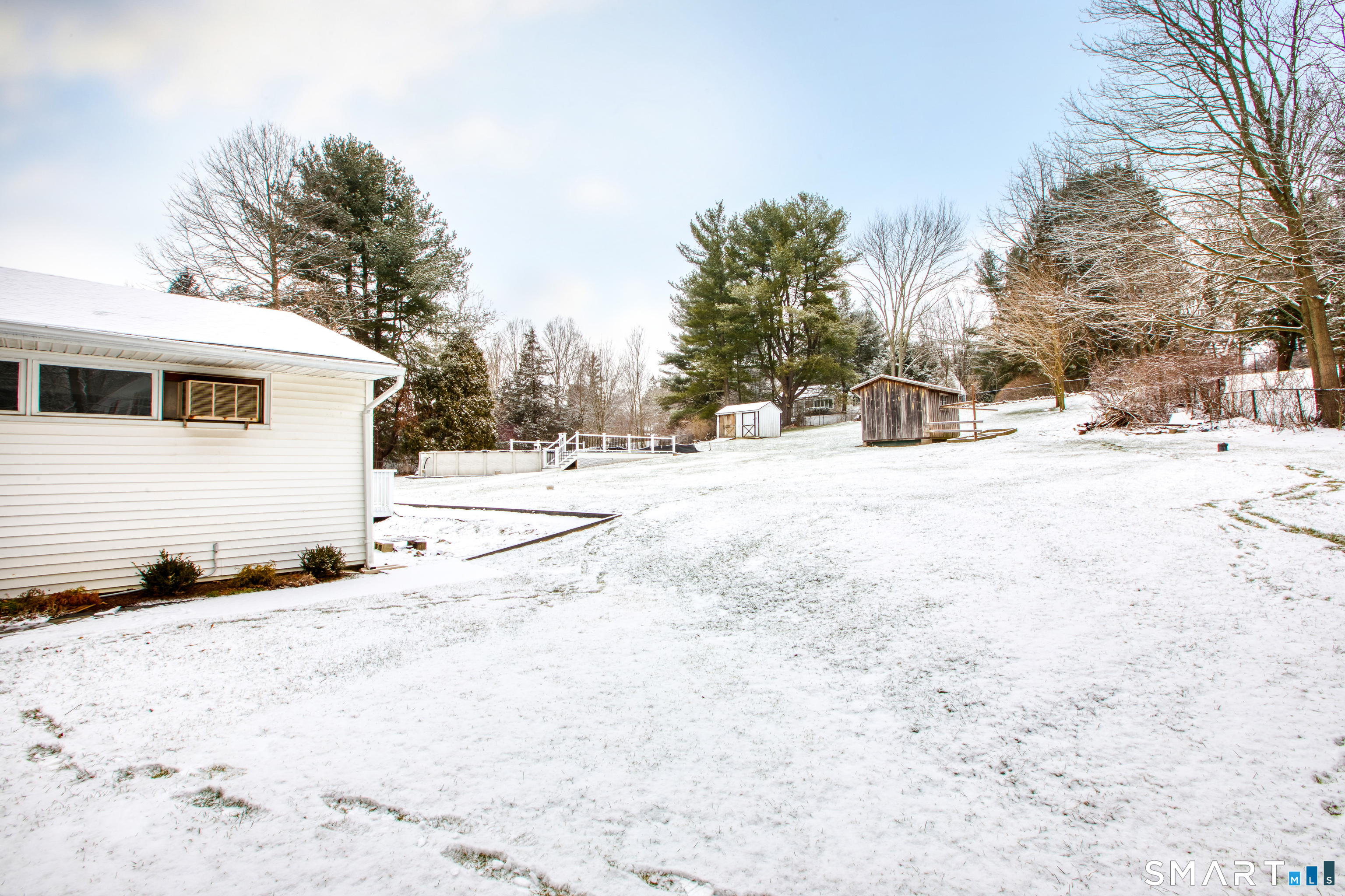 4 Edmond Road Bethel, CT 06801 - Photo 4 of 40 a view of a yard covered in snow