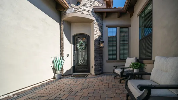 a kitchen with granite countertop white cabinets and a stove