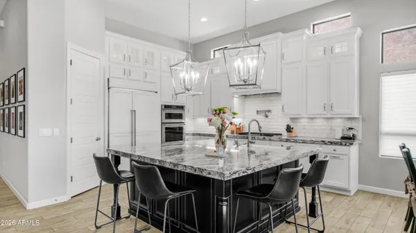 a bedroom with a large bed and a flat screen tv