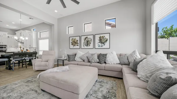 an aerial view of a house with a yard and large trees