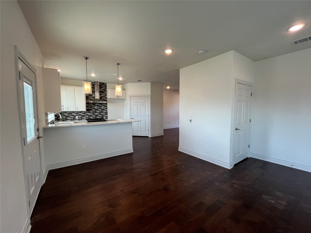 2105 Tiger Trail, Unit 501 Round Rock, TX 78664 - Photo 5 of 10 a view of a kitchen with a sink and a refrigerator