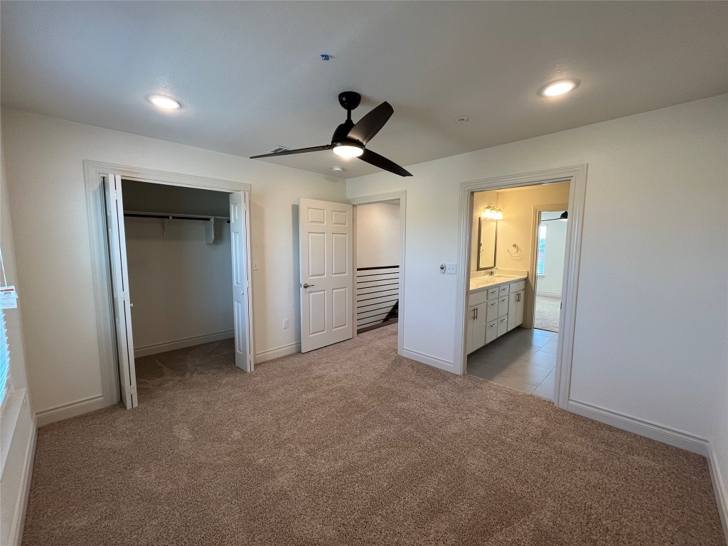 2105 Tiger Trail, Unit 501 Round Rock, TX 78664 - Photo 8 of 10 wooden floor in an empty room with a window