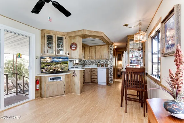 a kitchen with stainless steel appliances kitchen island hardwood floor and stove