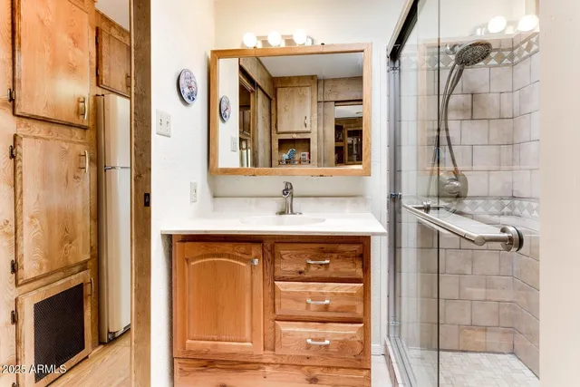 a bathroom with a sink and a mirror