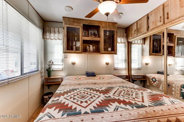 a bedroom with a bed and window