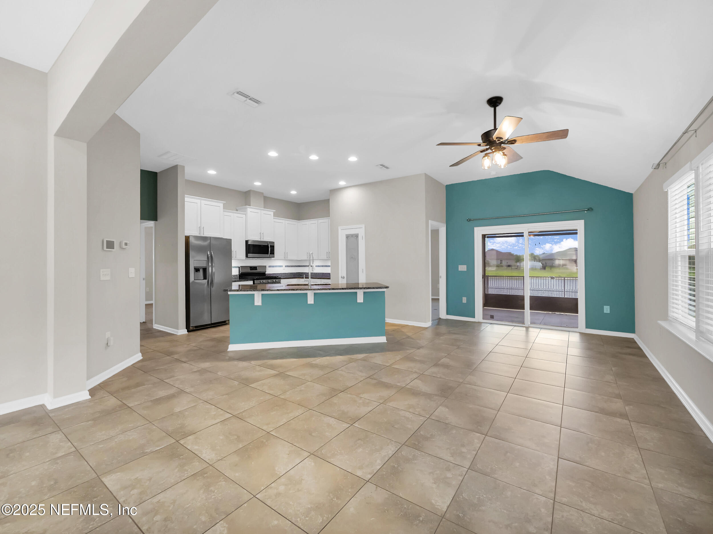 258 Fox Water Trail St. Augustine, FL 32086 - Photo 11 of 50 a view of kitchen with furniture and refrigerator
