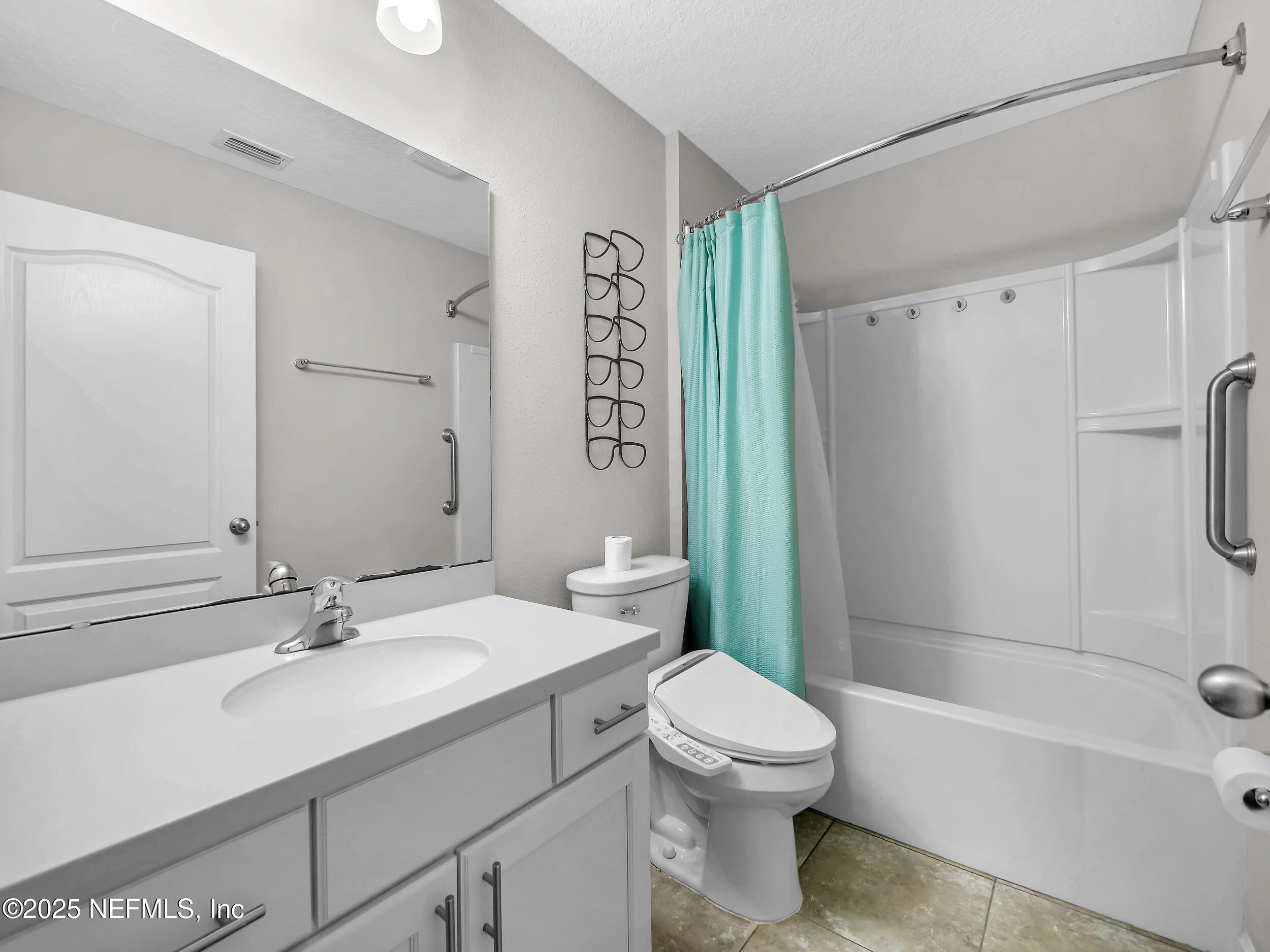 258 Fox Water Trail St. Augustine, FL 32086 - Photo 13 of 50 a bathroom with a sink a toilet and a bathtub