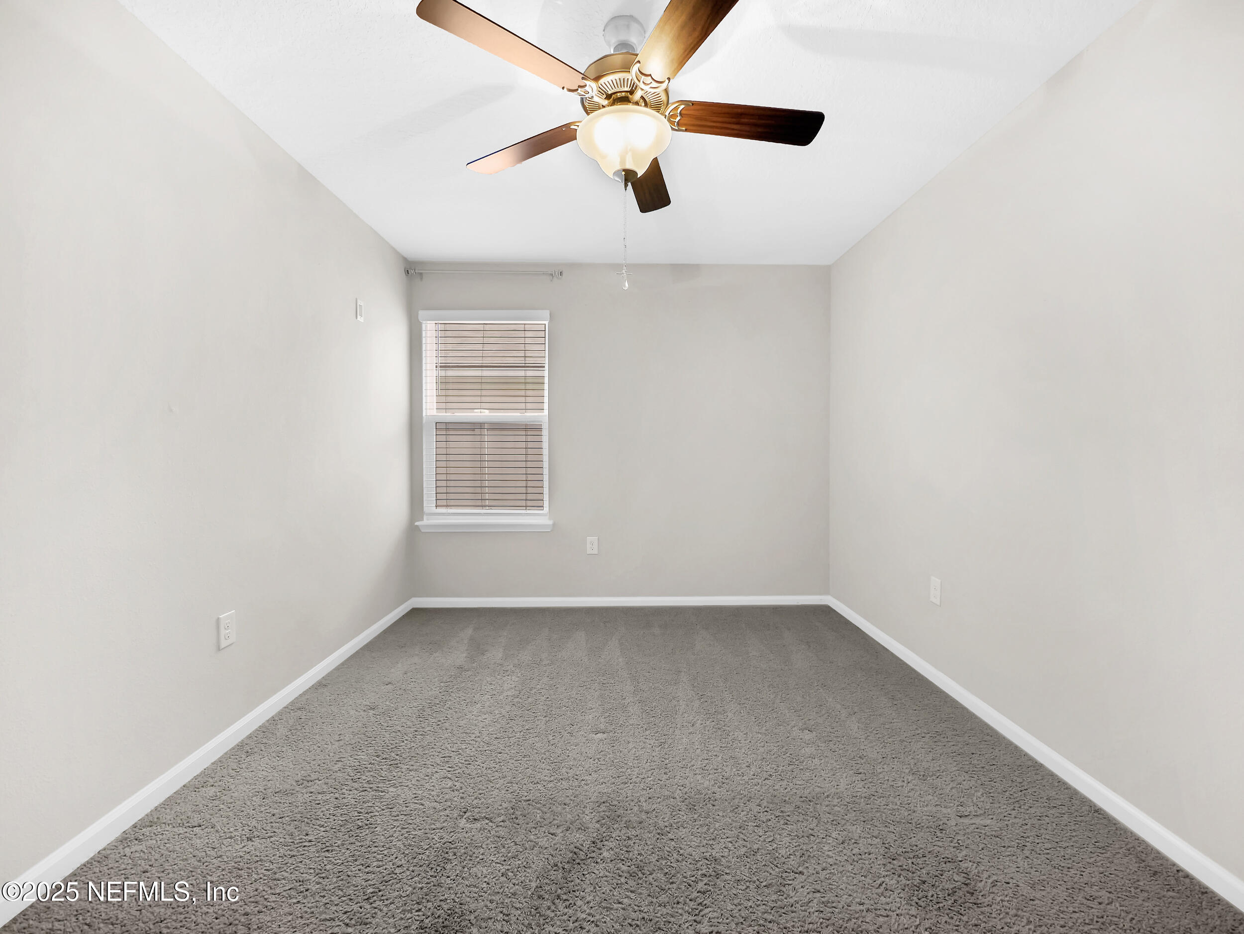 258 Fox Water Trail St. Augustine, FL 32086 - Photo 17 of 50 an empty room with windows and fan