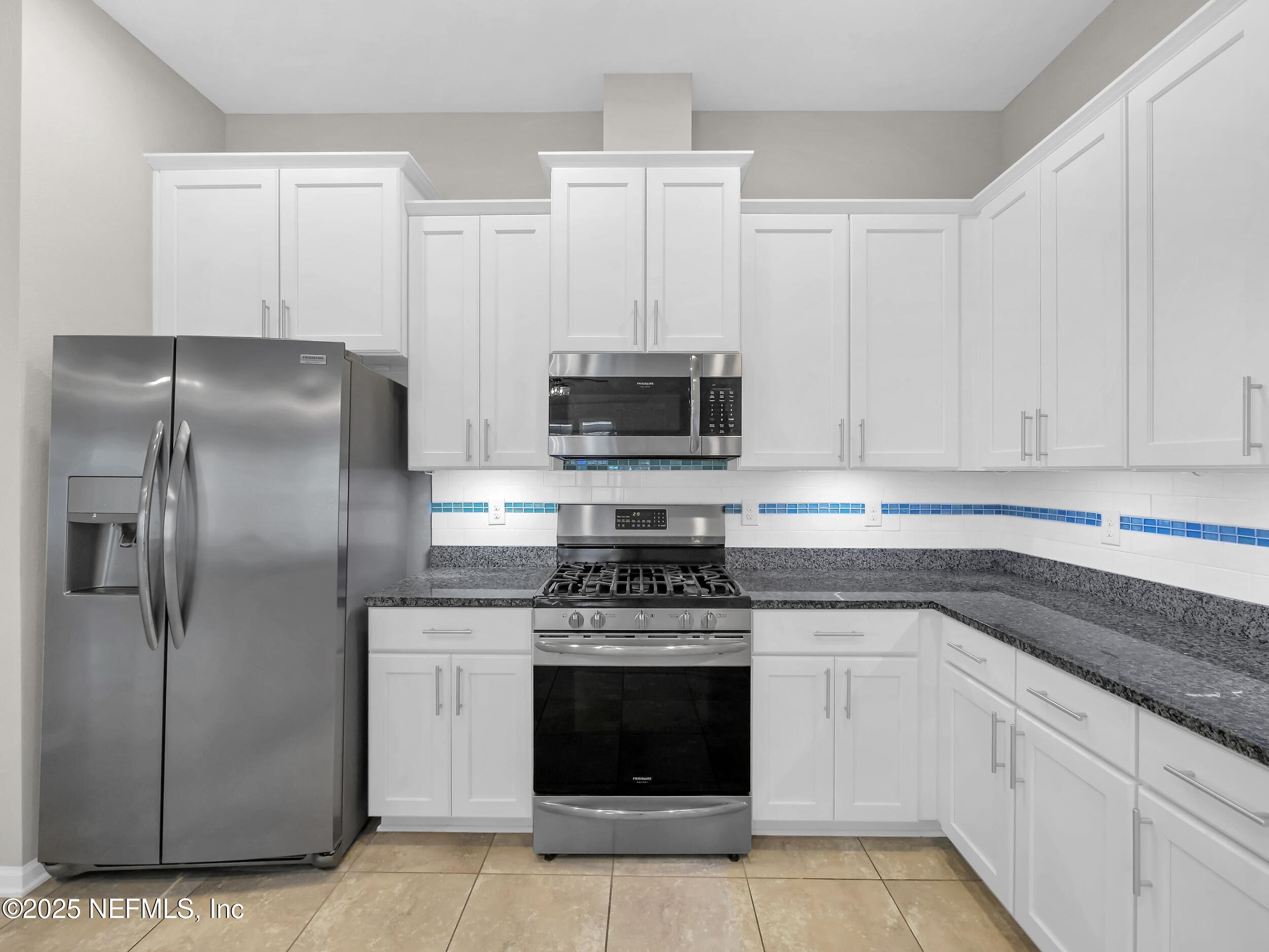258 Fox Water Trail St. Augustine, FL 32086 - Photo 20 of 50 a kitchen with cabinets stainless steel appliances and a counter space