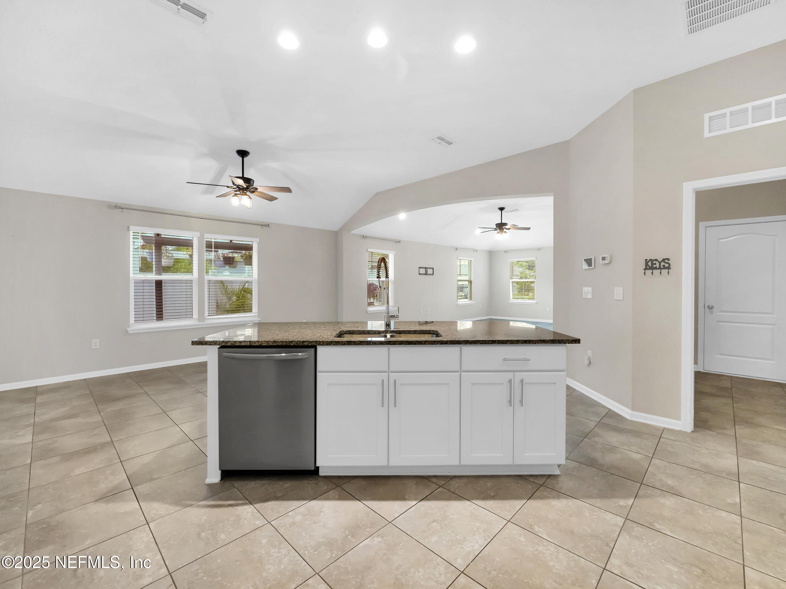 258 Fox Water Trail St. Augustine, FL 32086 - Photo 22 of 50 a large bathroom with a granite countertop sink and a mirror