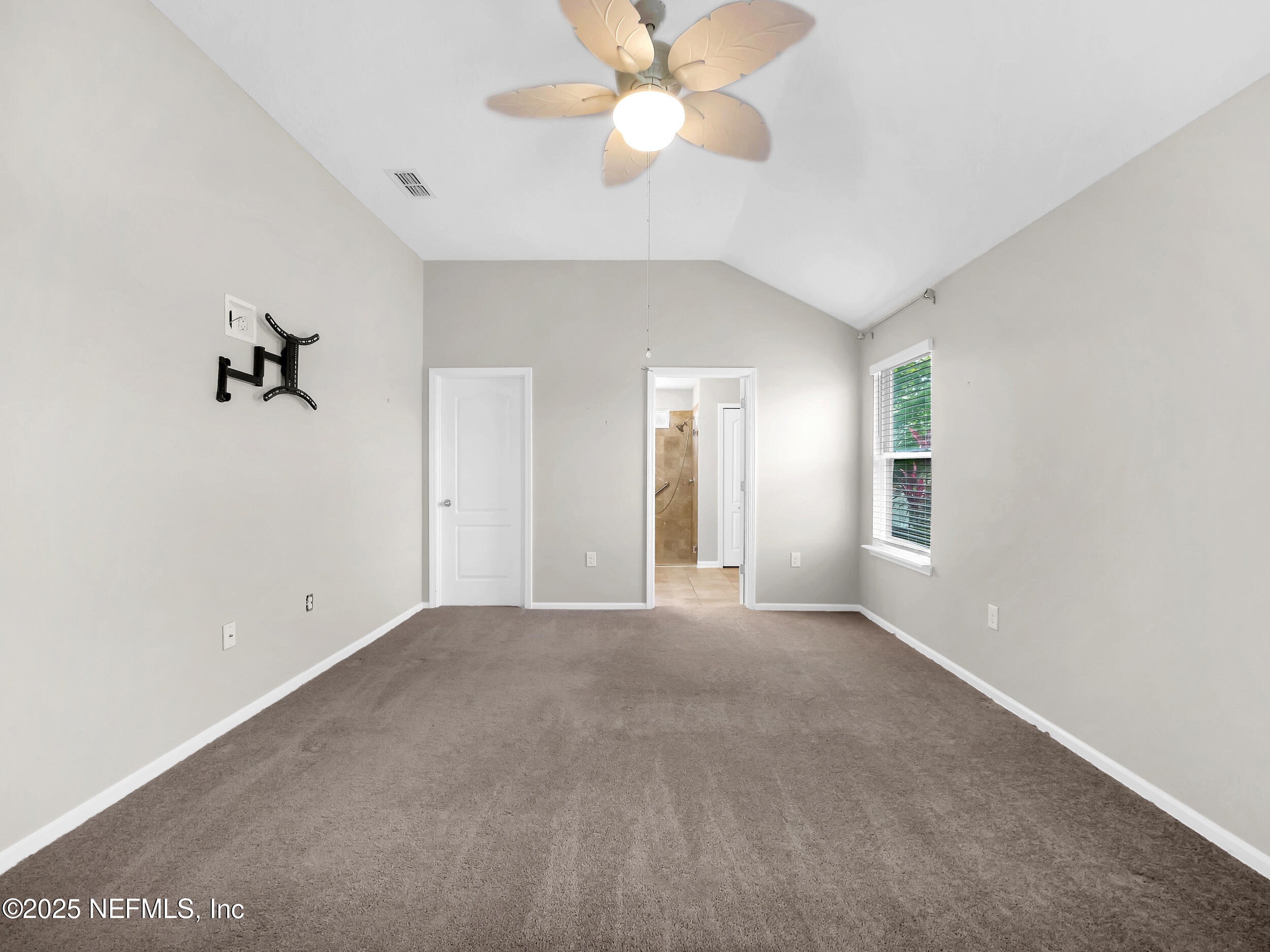 258 Fox Water Trail St. Augustine, FL 32086 - Photo 25 of 50 a view of a room with a ceiling fan and a window