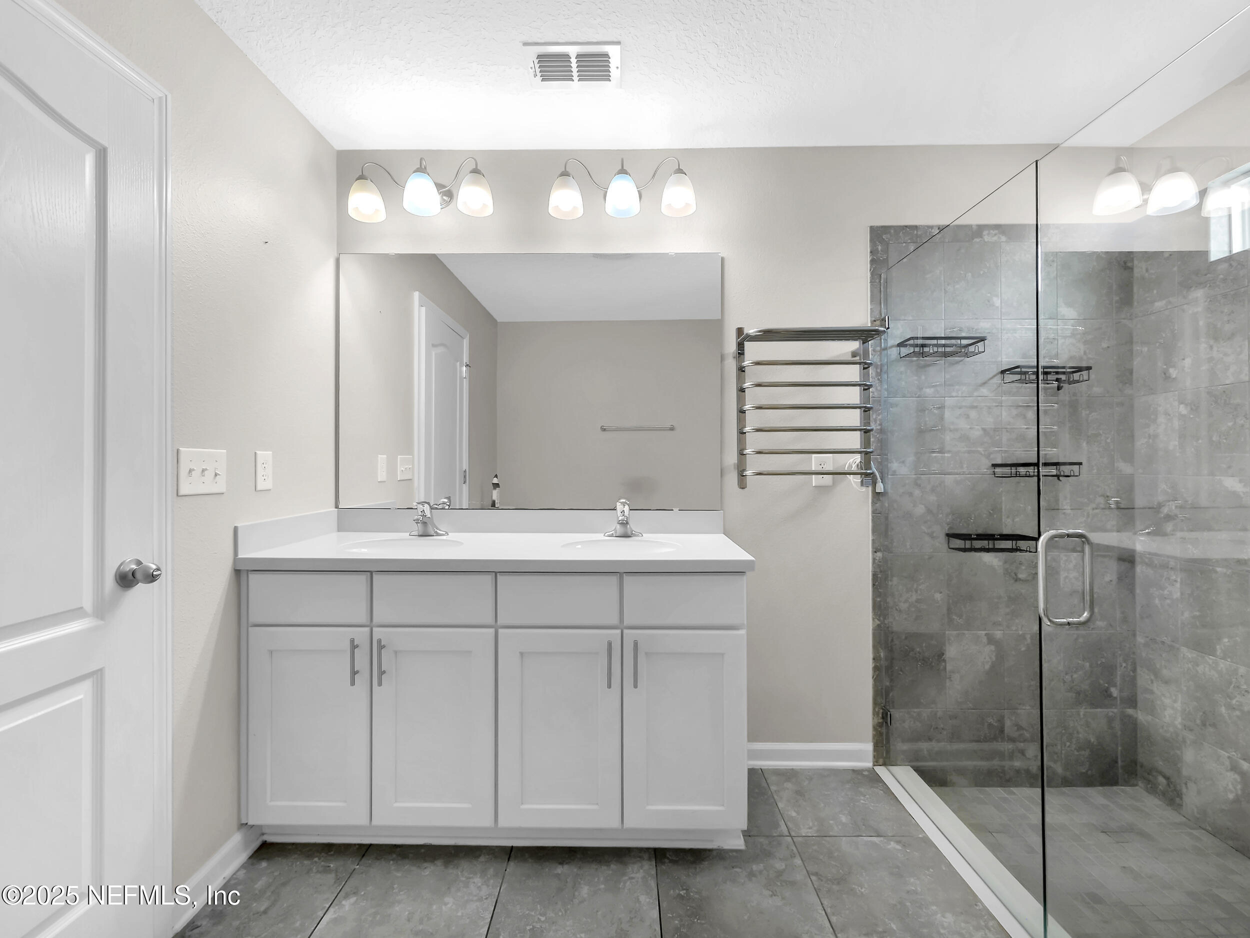 258 Fox Water Trail St. Augustine, FL 32086 - Photo 29 of 50 a bathroom with a double vanity sink mirror and shower
