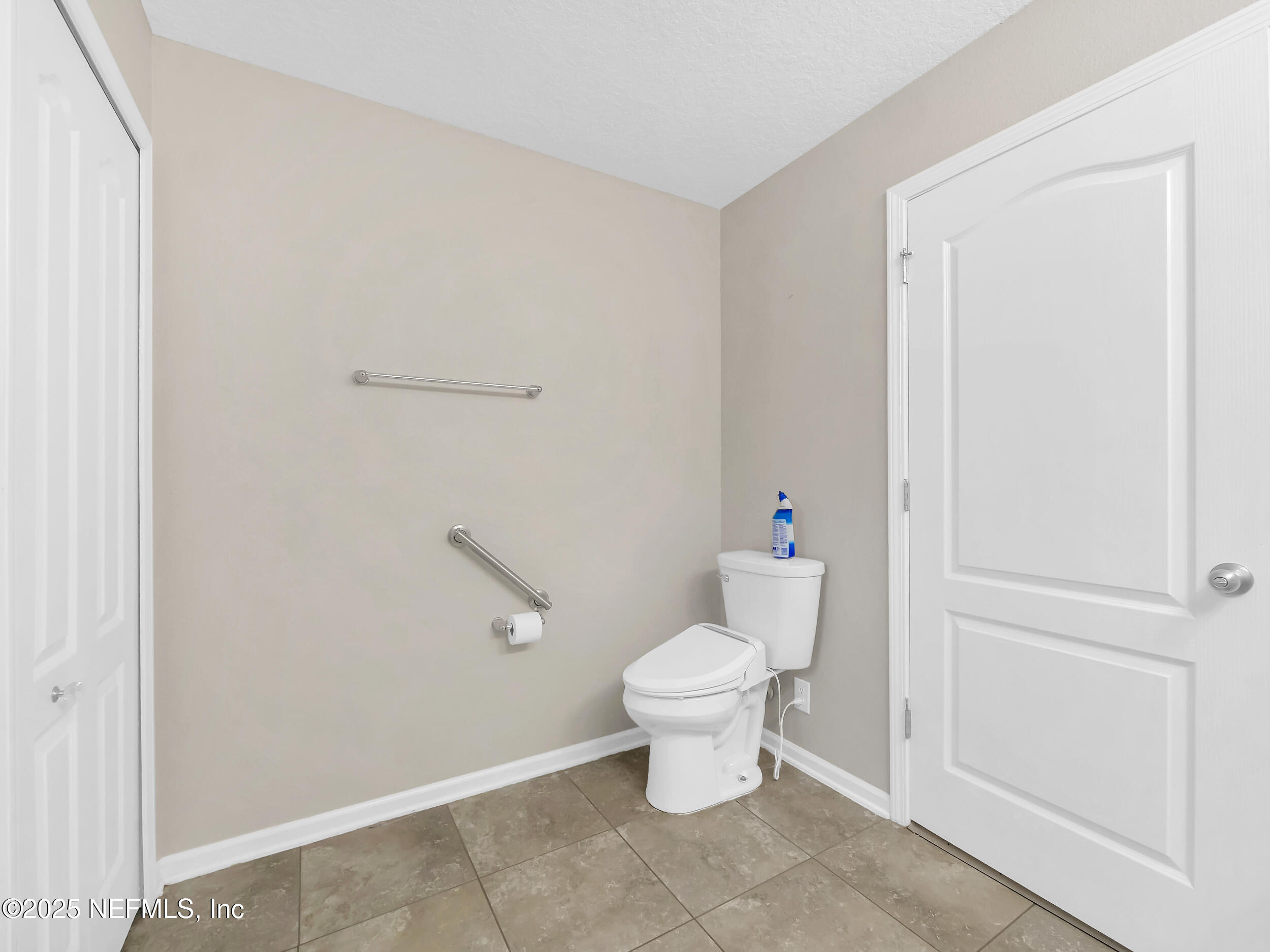 258 Fox Water Trail St. Augustine, FL 32086 - Photo 31 of 50 a white toilet sitting next to a bathroom sink