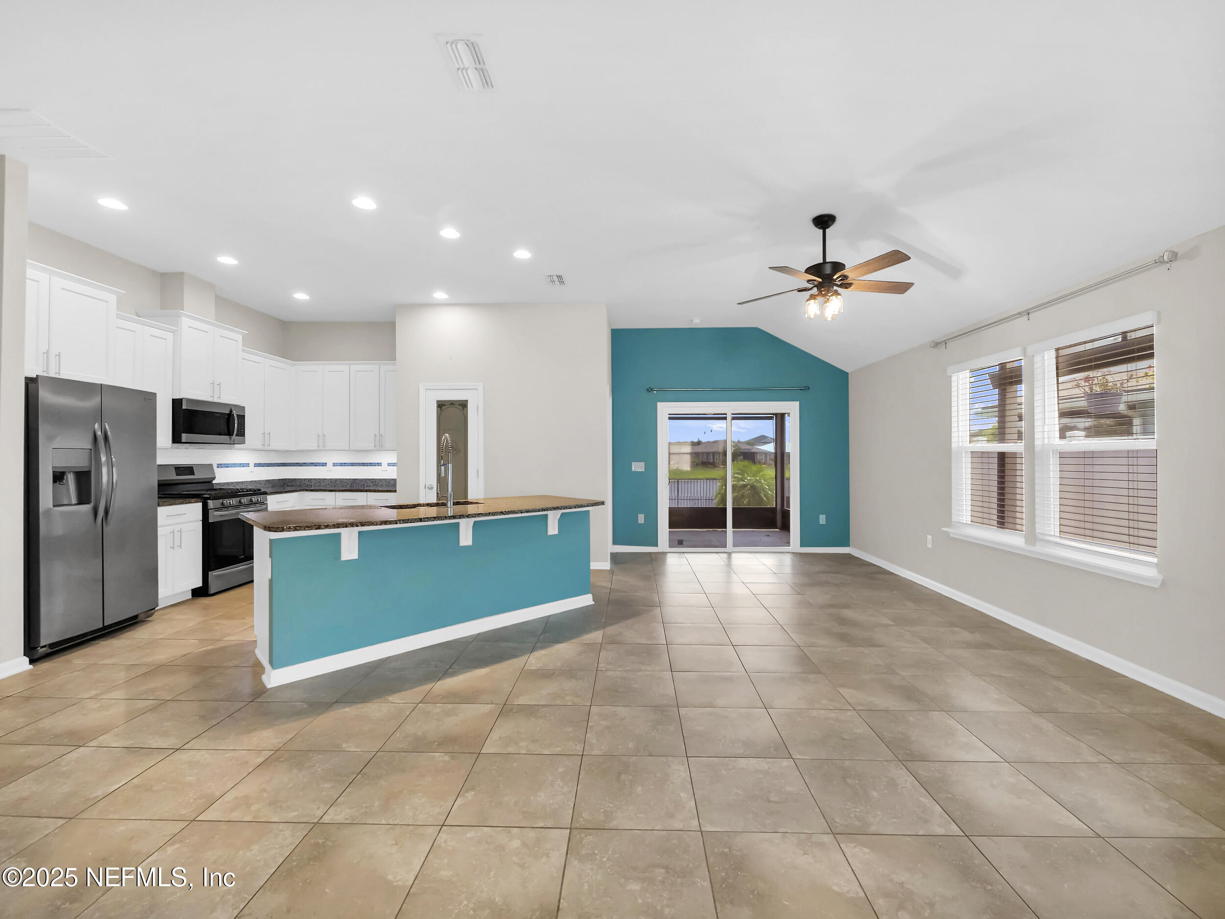 258 Fox Water Trail St. Augustine, FL 32086 - Photo 32 of 50 a view of kitchen with stainless steel appliances kitchen island granite countertop a sink and cabinets