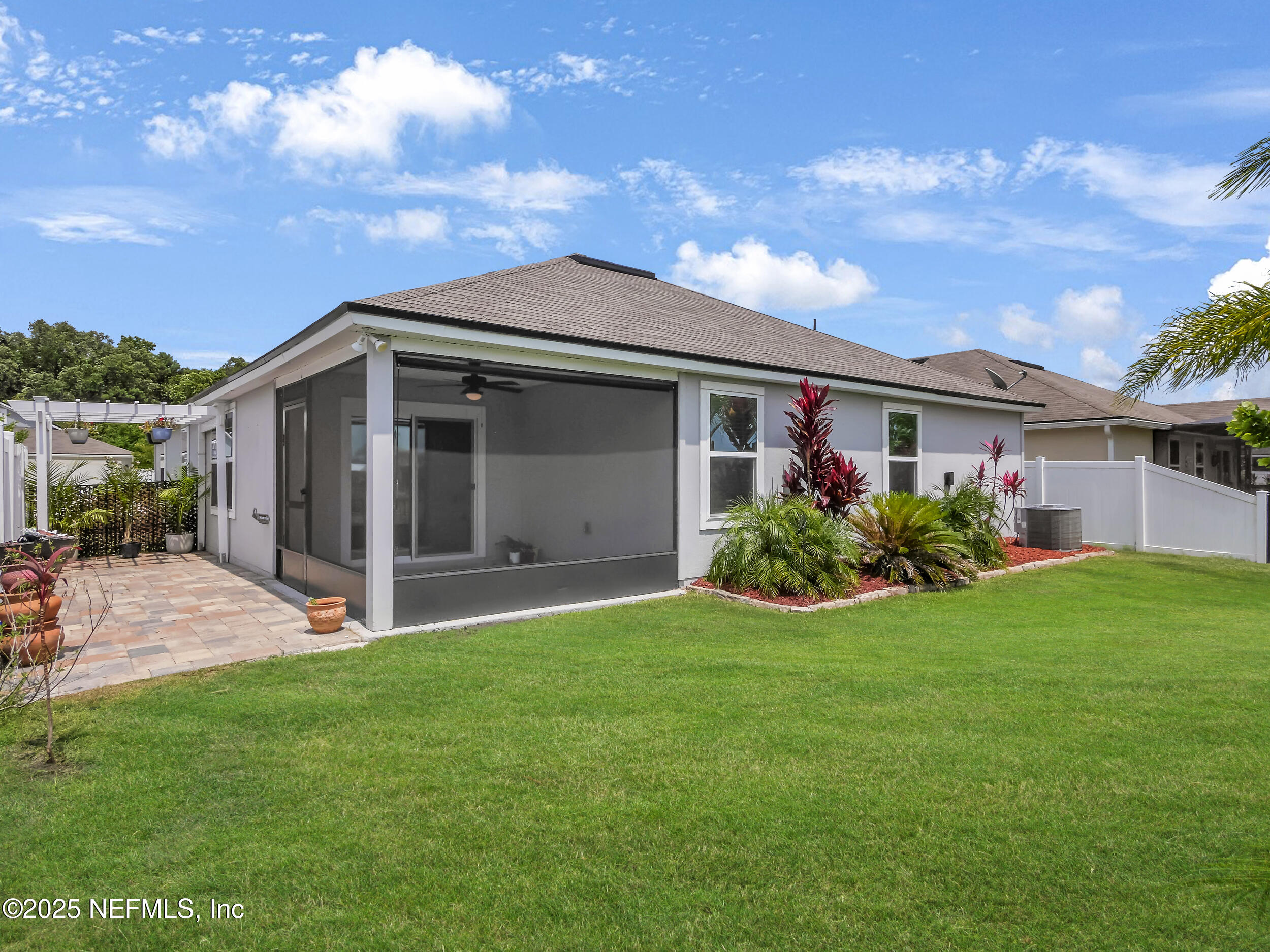 258 Fox Water Trail St. Augustine, FL 32086 - Photo 34 of 50 a view of a house with a yard and potted plants