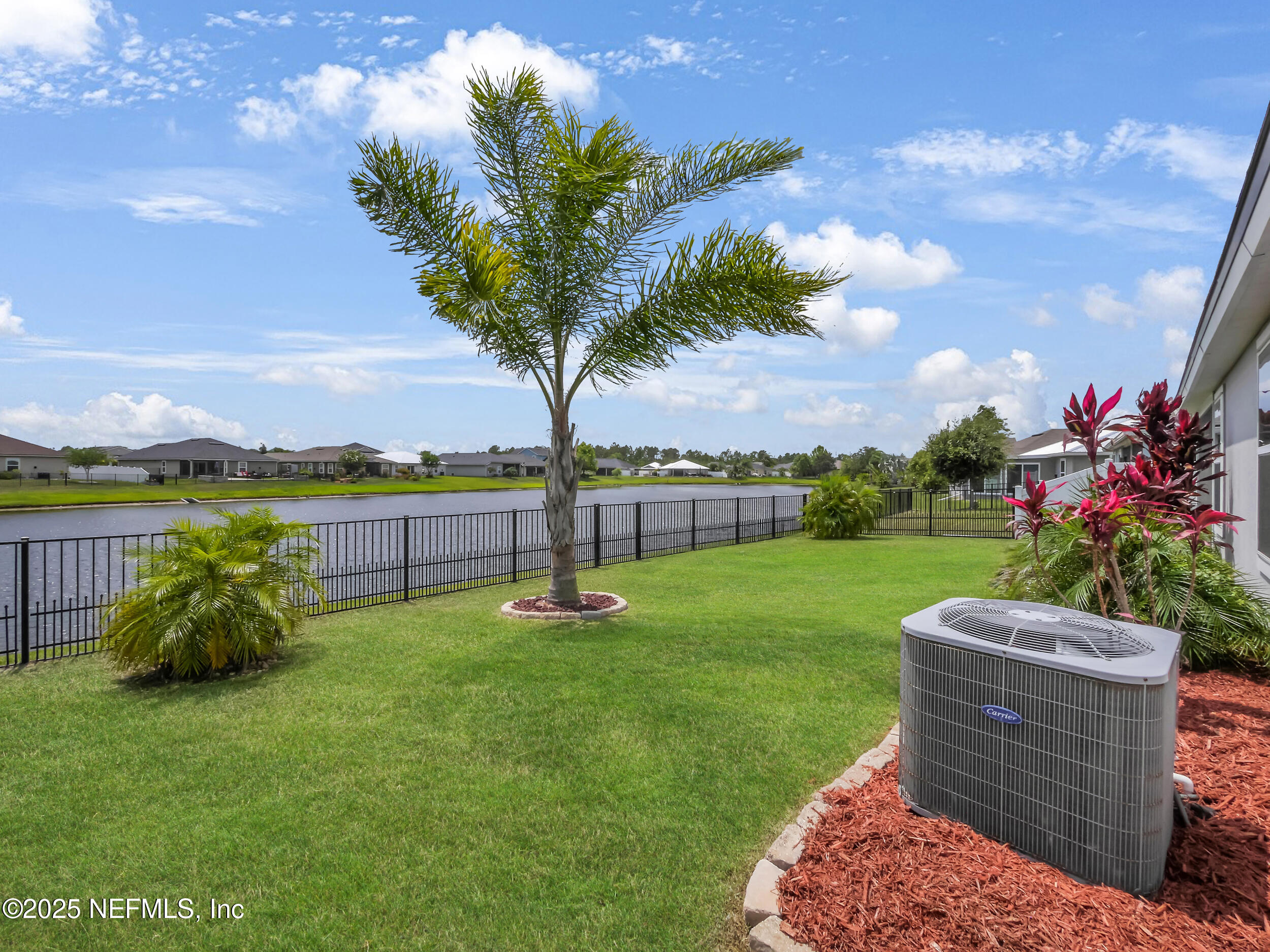 258 Fox Water Trail St. Augustine, FL 32086 - Photo 38 of 50 a view of a garden with houses