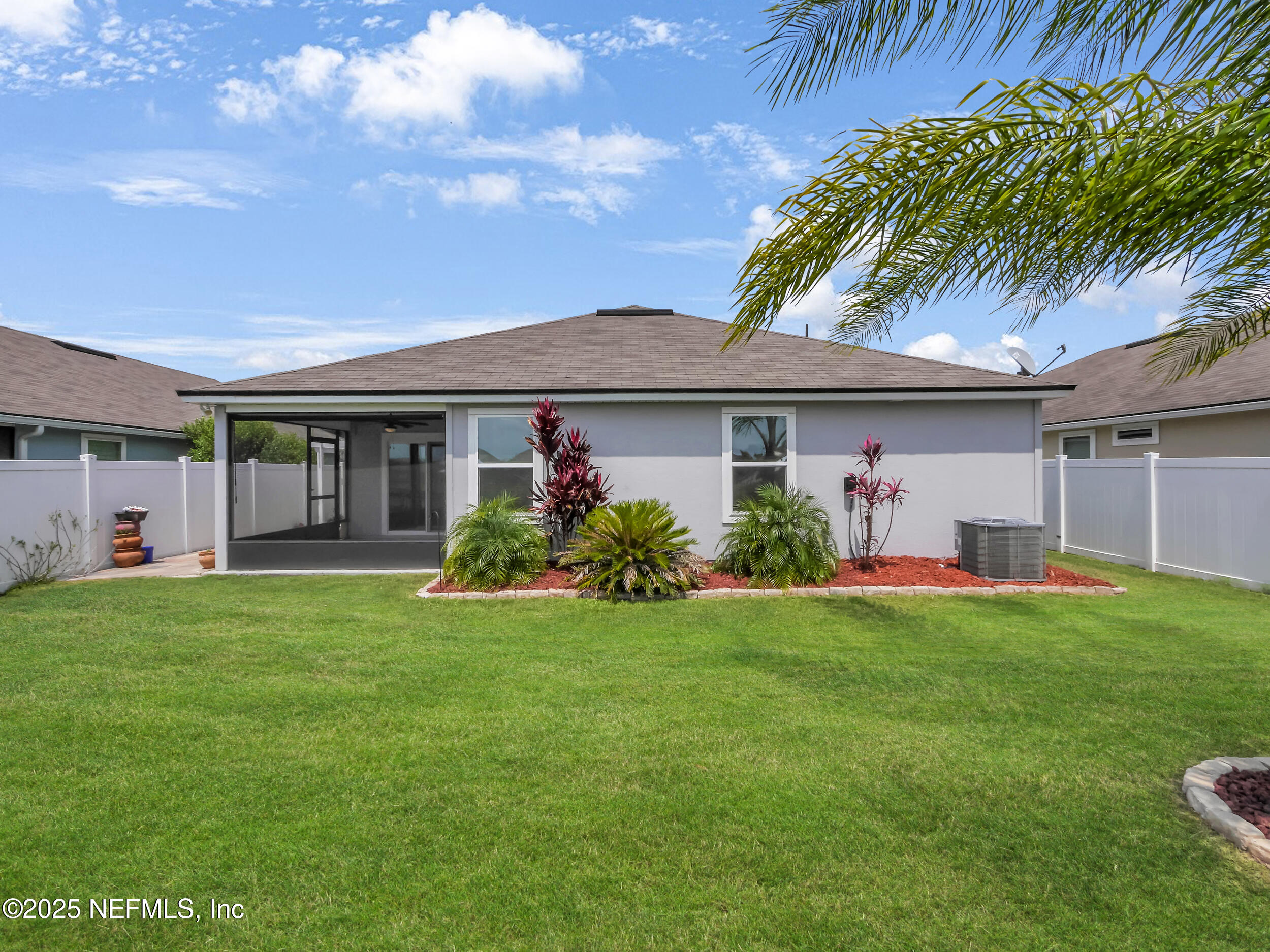 258 Fox Water Trail St. Augustine, FL 32086 - Photo 39 of 50 a front view of a house with a garden and plants