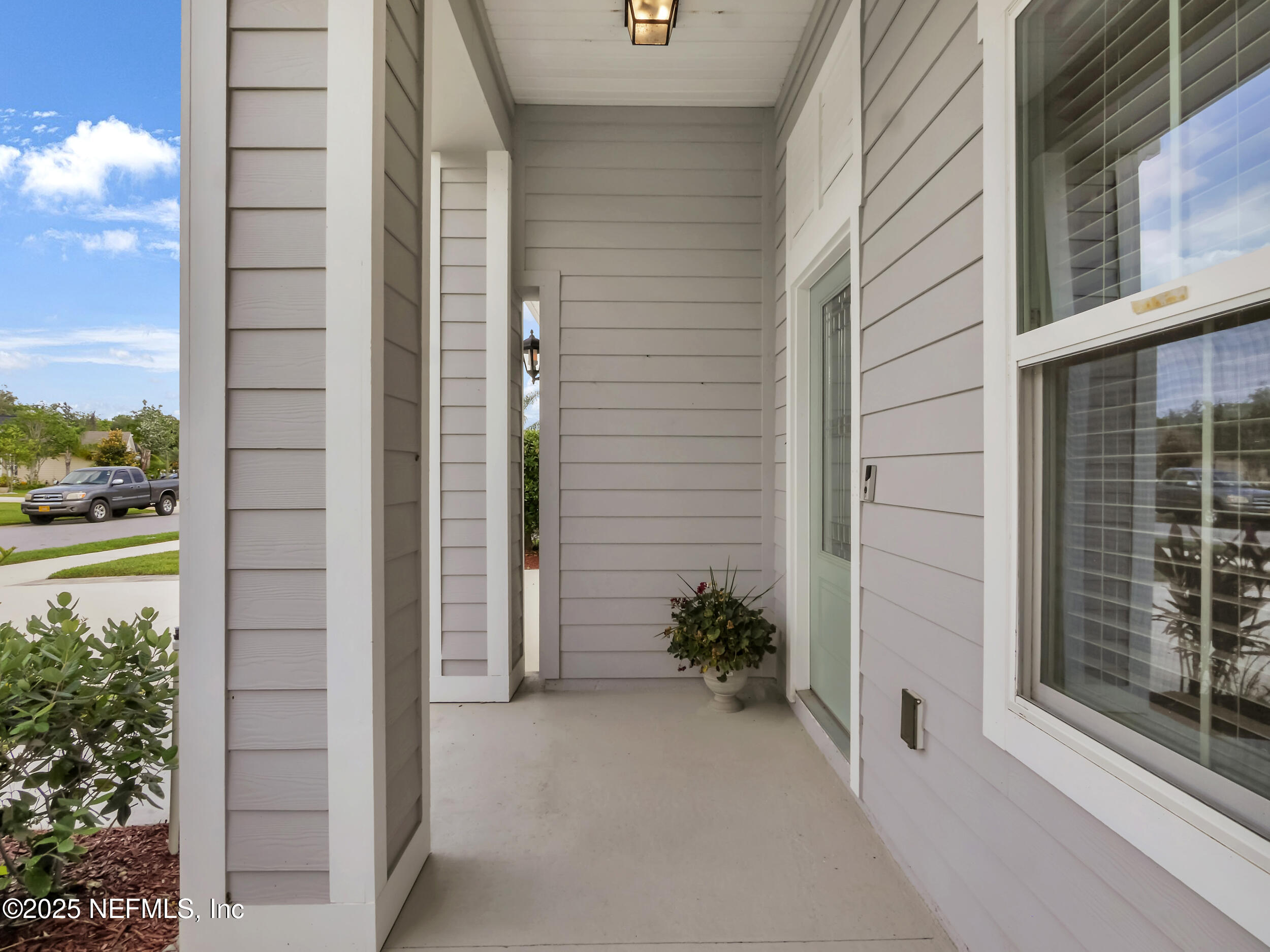 258 Fox Water Trail St. Augustine, FL 32086 - Photo 6 of 50 a potted plant sitting in front of a glass door