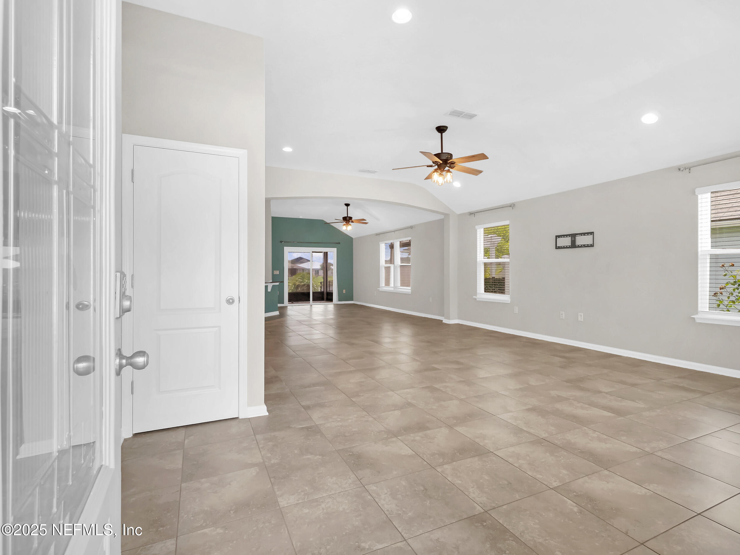 258 Fox Water Trail St. Augustine, FL 32086 - Photo 7 of 50 wooden floor in an empty room with a window
