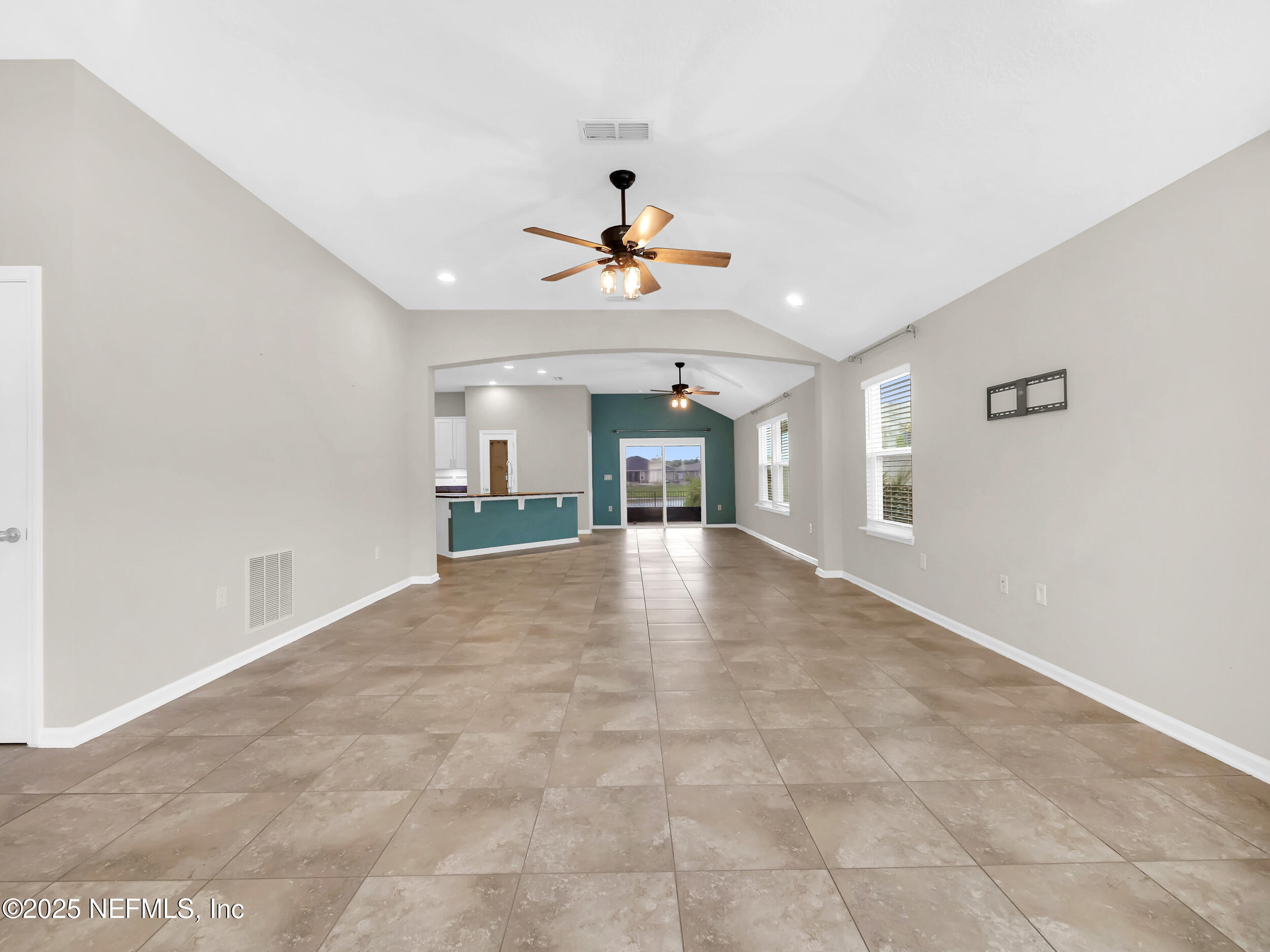 258 Fox Water Trail St. Augustine, FL 32086 - Photo 8 of 50 a view of an empty room with a kitchen