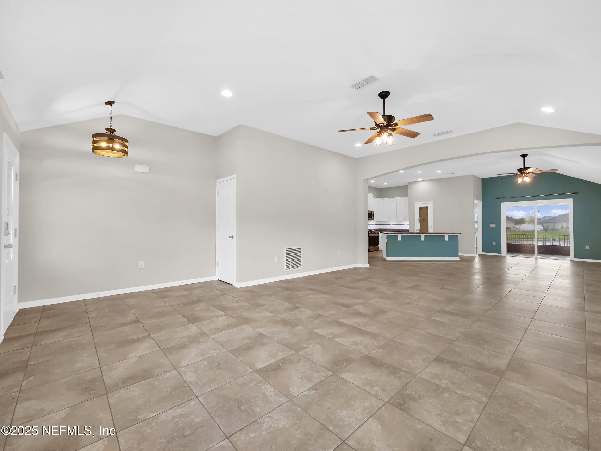 258 Fox Water Trail St. Augustine, FL 32086 - Photo 9 of 50 a view of an empty room with a kitchen