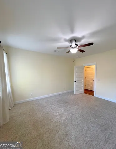 a view of a livingroom with a ceiling fan